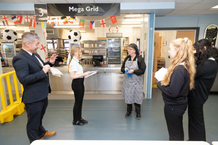 Staff member receiving a thank you card