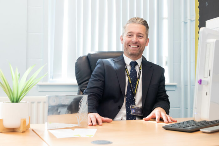 Headteacher with award